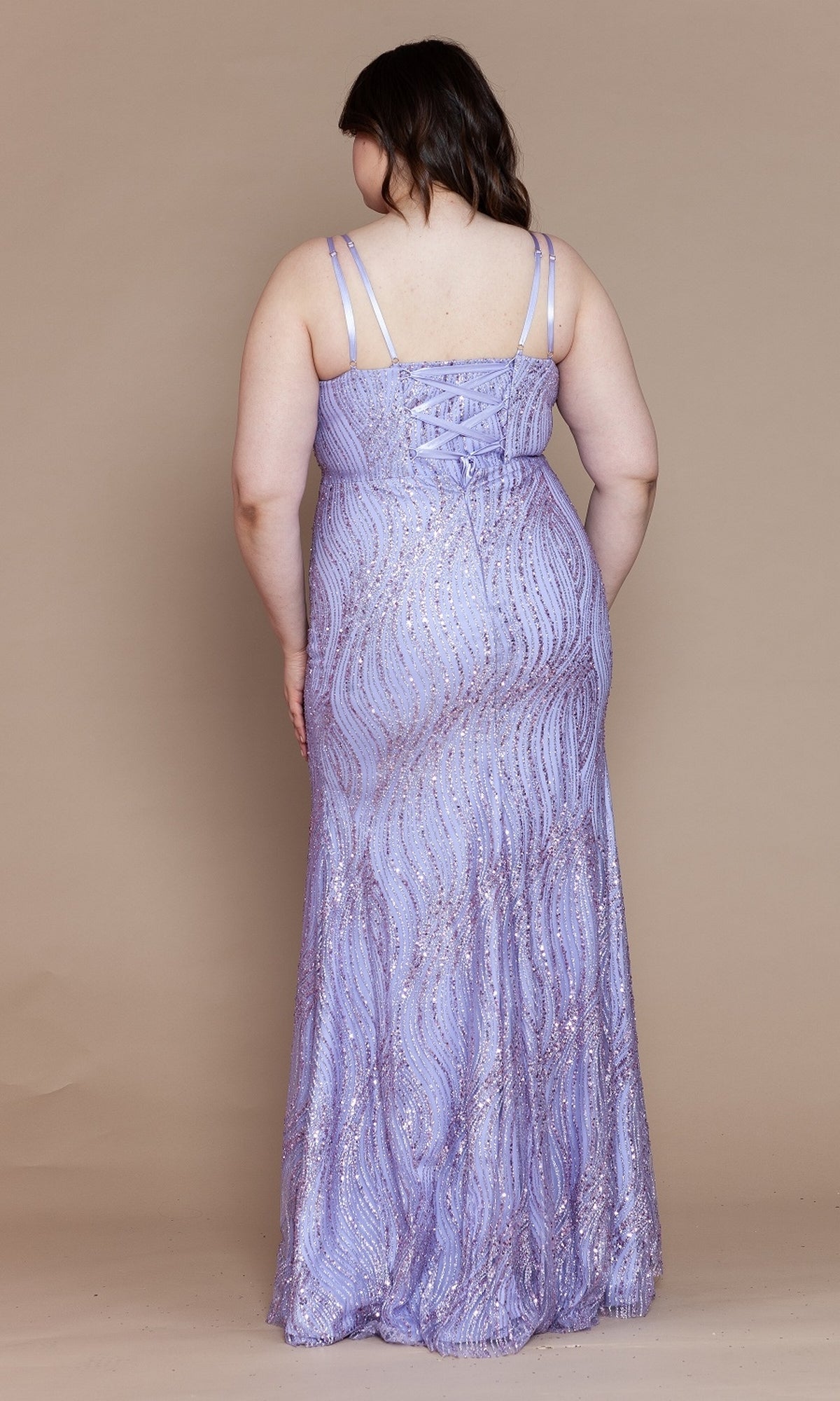 A woman stands with her back to the camera against a beige background, modeling the V-Neck Plus-Size Long Glitter Prom Dress W1156—a sleeveless, lavender gown with a sparkling print.